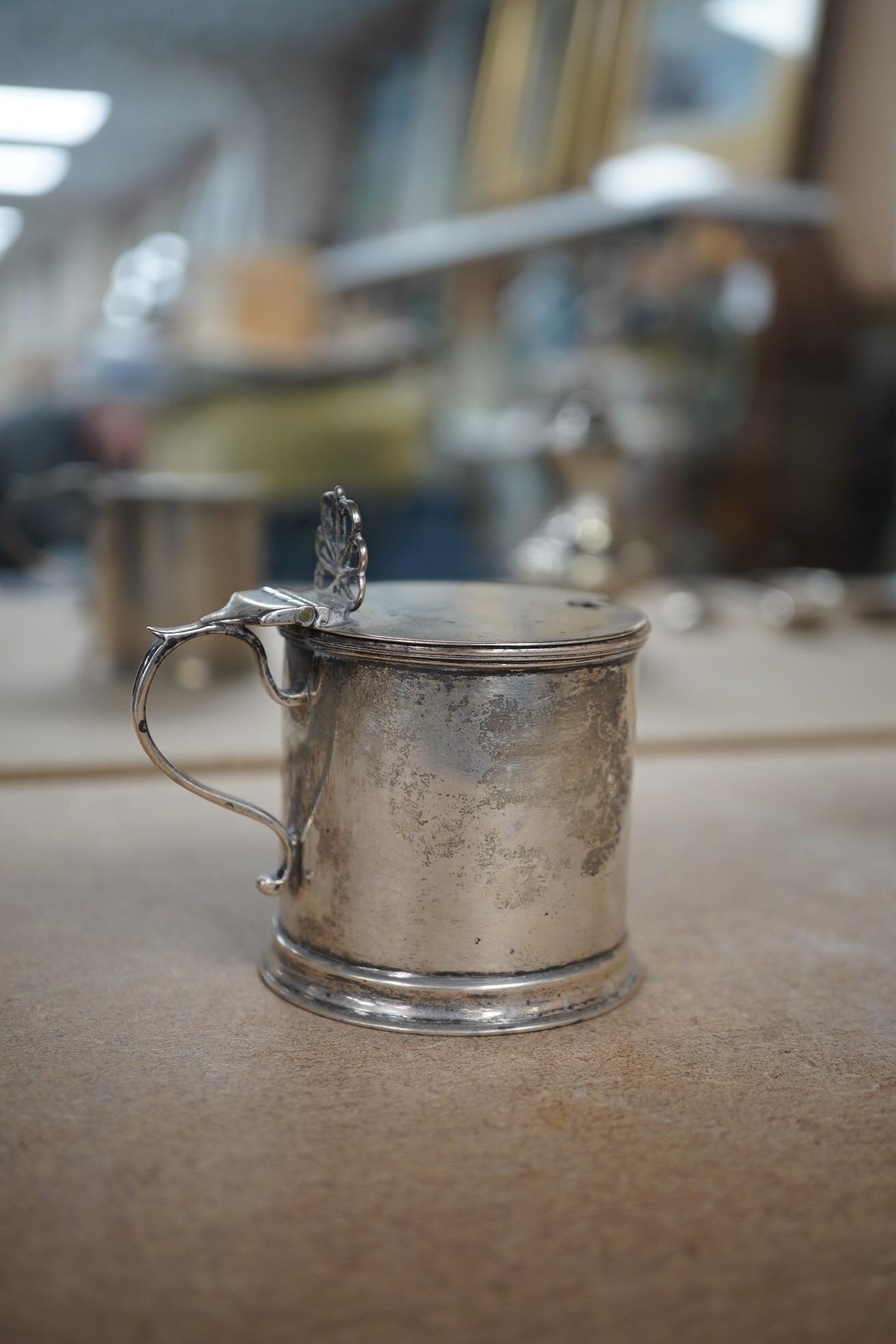 Sundry small silver including a pair of Edwardian silver drum mustards, London, 1907/8, 73mm, a Georgian pepperette, an Emes & Barnard pepperette, a Liberty & Co mustard pot, two other pepperettes and seven other items.